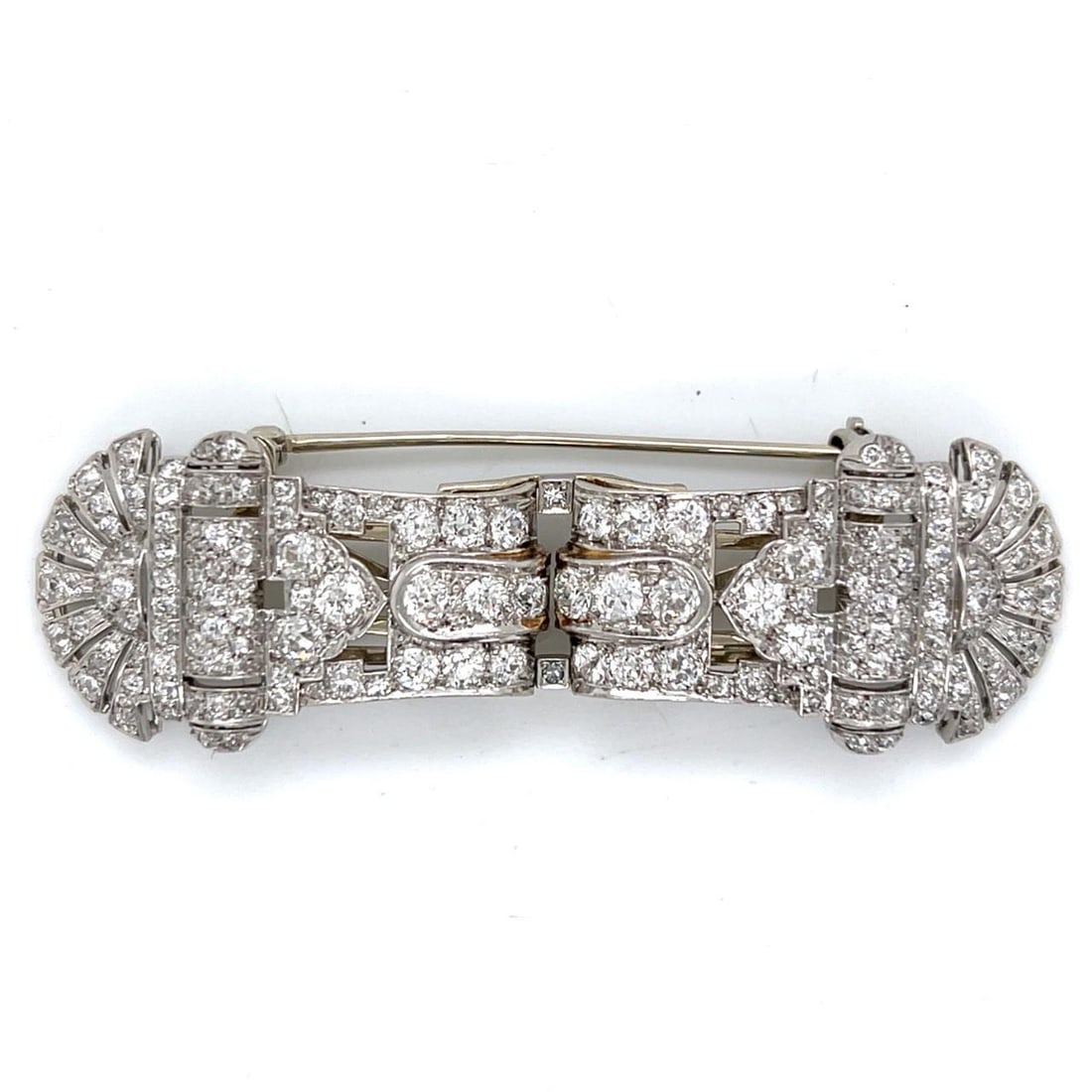 Platinum and 18K Gold Art Deco Diamond Clip Brooch with 7 Carats Old Mine Stones: Platinum and 18K Gold Art Deco Diamond Clip Brooch with 7 Carats Old Mine Stones This Art Deco brooch features platinum and 18K gold, set with 172 Old Mine cut diamonds totaling approximately 7.00 car