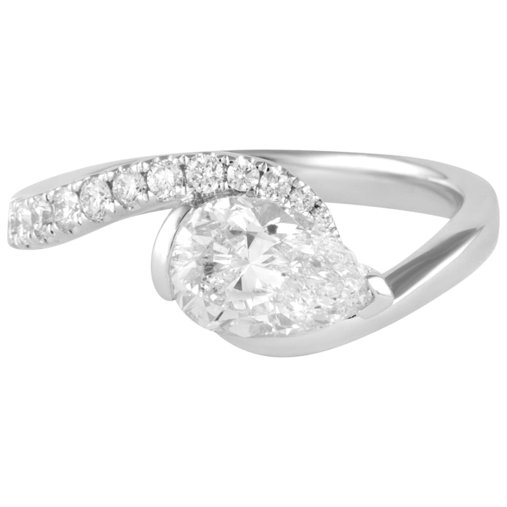 1.12ct Pear Diamond Abstract Ring 18k White Gold EGL Certified: 1.12ct Pear Diamond Abstract Ring 18k White Gold EGL Certified This stunning abstract ring features a 1.12ct pear brilliant diamond set in exquisite 18k white gold. The ring is designed in a contempor