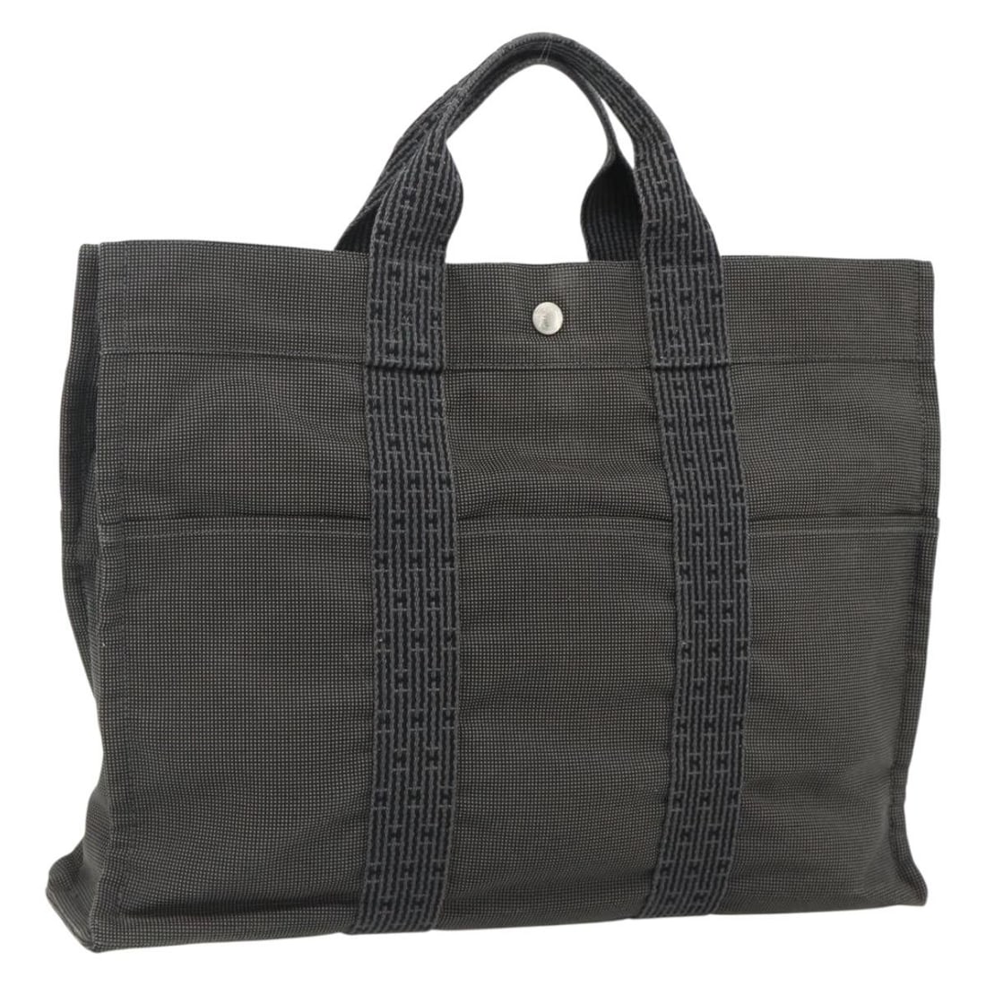 HERMES Her Line MM Nylon Hand Bag Gray Silver France: HERMES Her Line MM Nylon Hand Bag Gray Silver France Hermes Her Line MM hand bag in gray and silver nylon, made in France. The bag is a women's hand bag with a structured size of approximately 42 cm W
