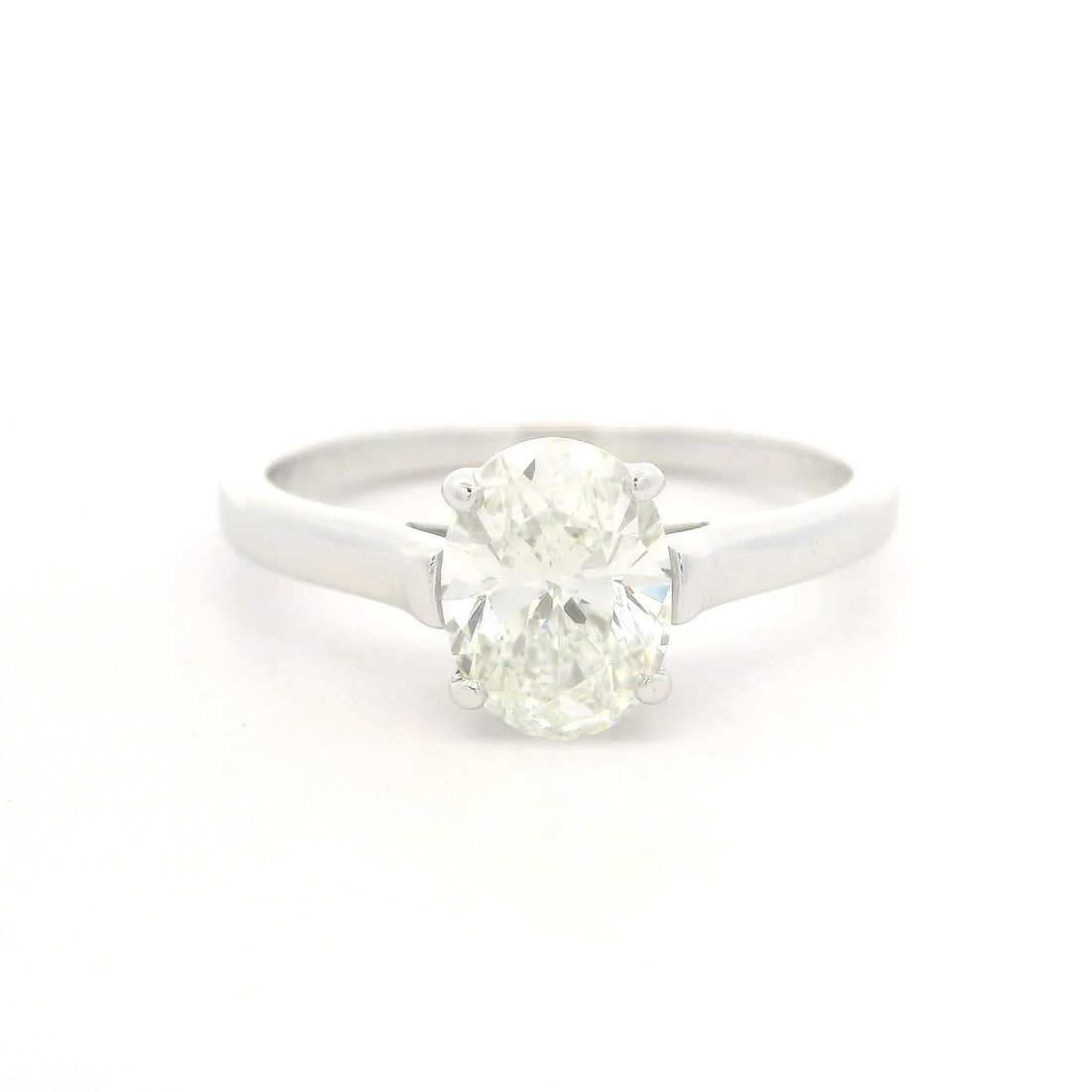 Tiffany & Co. Vintage Platinum GIA 1.52ct Oval Diamond Engagement Ring: Tiffany & Co. Vintage Platinum GIA 1.52ct Oval Diamond Engagement Ring This exquisite Vintage Tiffany & Co. engagement ring showcases a stunning 1.52ct oval brilliant cut diamond, prong set to highlig