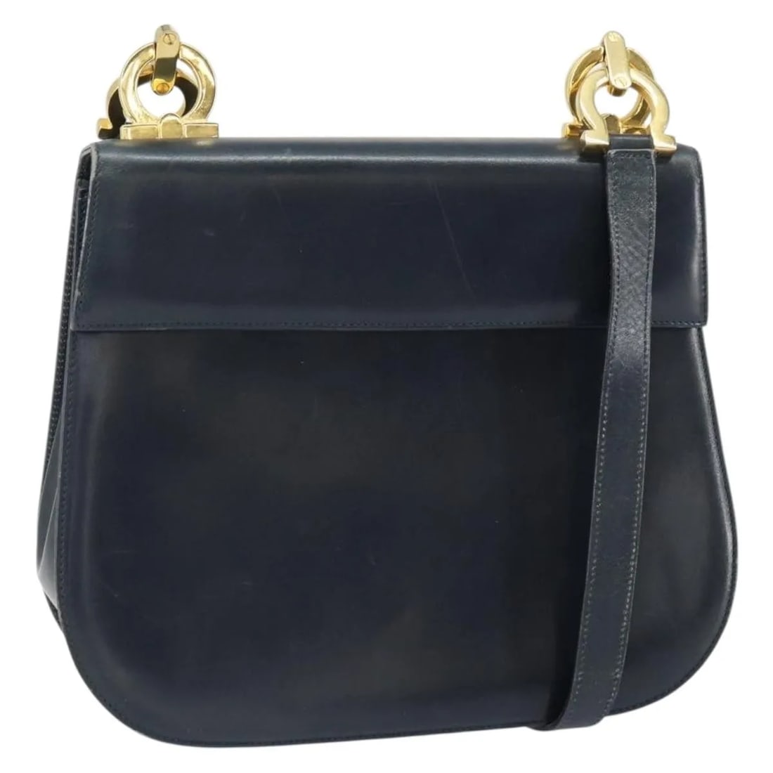 Salvatore Ferragamo Gancini Navy Leather Shoulder Bag: Salvatore Ferragamo Gancini Navy Leather Shoulder Bag This Salvatore Ferragamo Gancini shoulder bag for women features navy leather construction with metal fittings. The bag measures 24cm x 20cm x 7cm