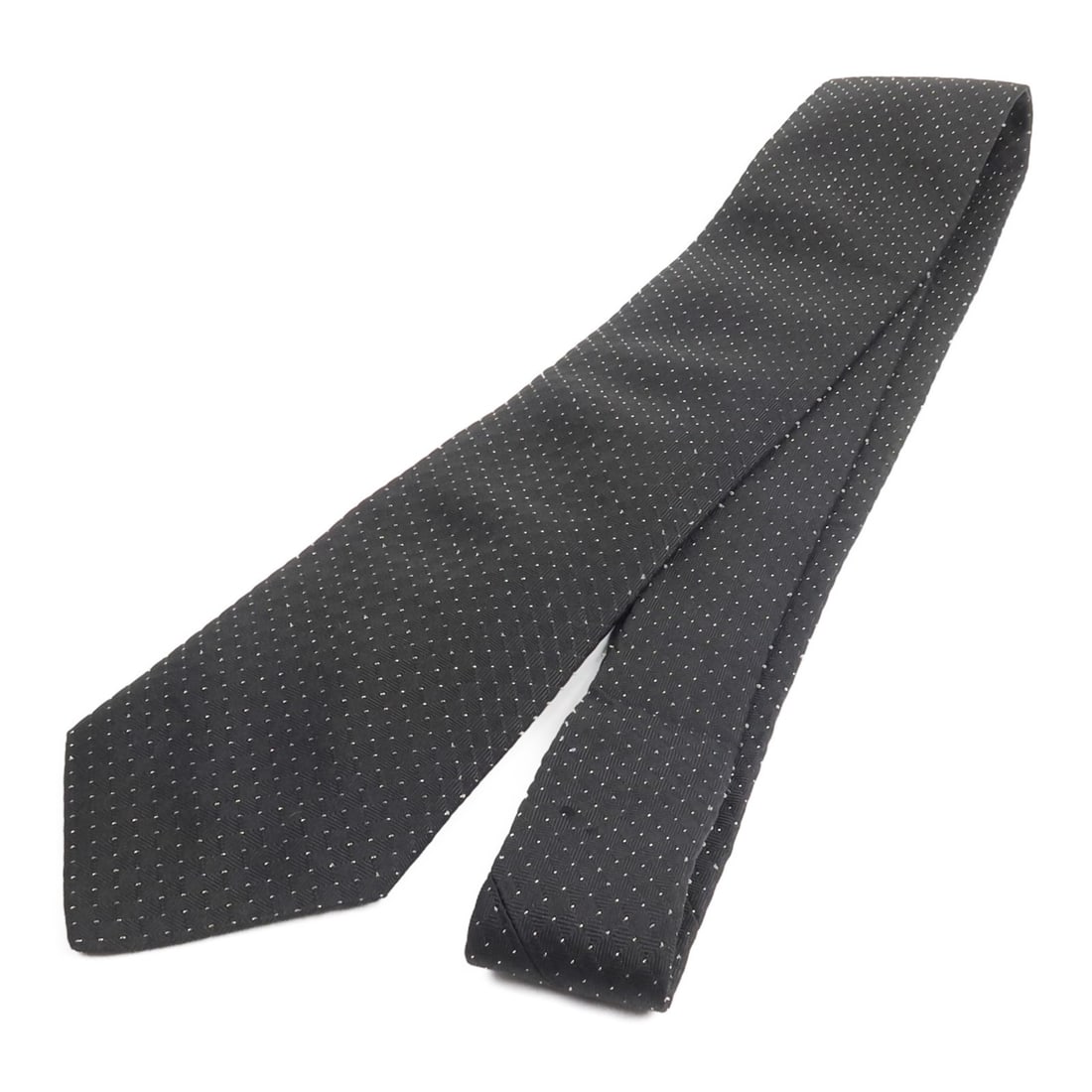 Hermes 428810T04 Black Silk Nylon Necktie: Hermes 428810T04 Black Silk Nylon Necktie A HERMES necktie in black, made from silk and nylon. It measures 76 cm in total length with a tip width of 7.8 cm. Condition is AB: Very Good. Accessories are