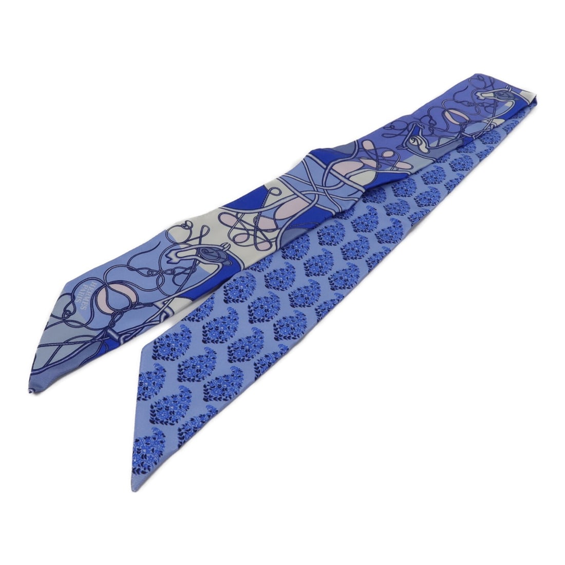 Hermes Twilly Silk Scarf Blue Women's France: Hermes Twilly Silk Scarf Blue Women's France Hermes Twilly scarf in blue silk, designed for women in regular size. Made in France, this scarf measures 86 cm x 5 cm and is offered in very good AB condi