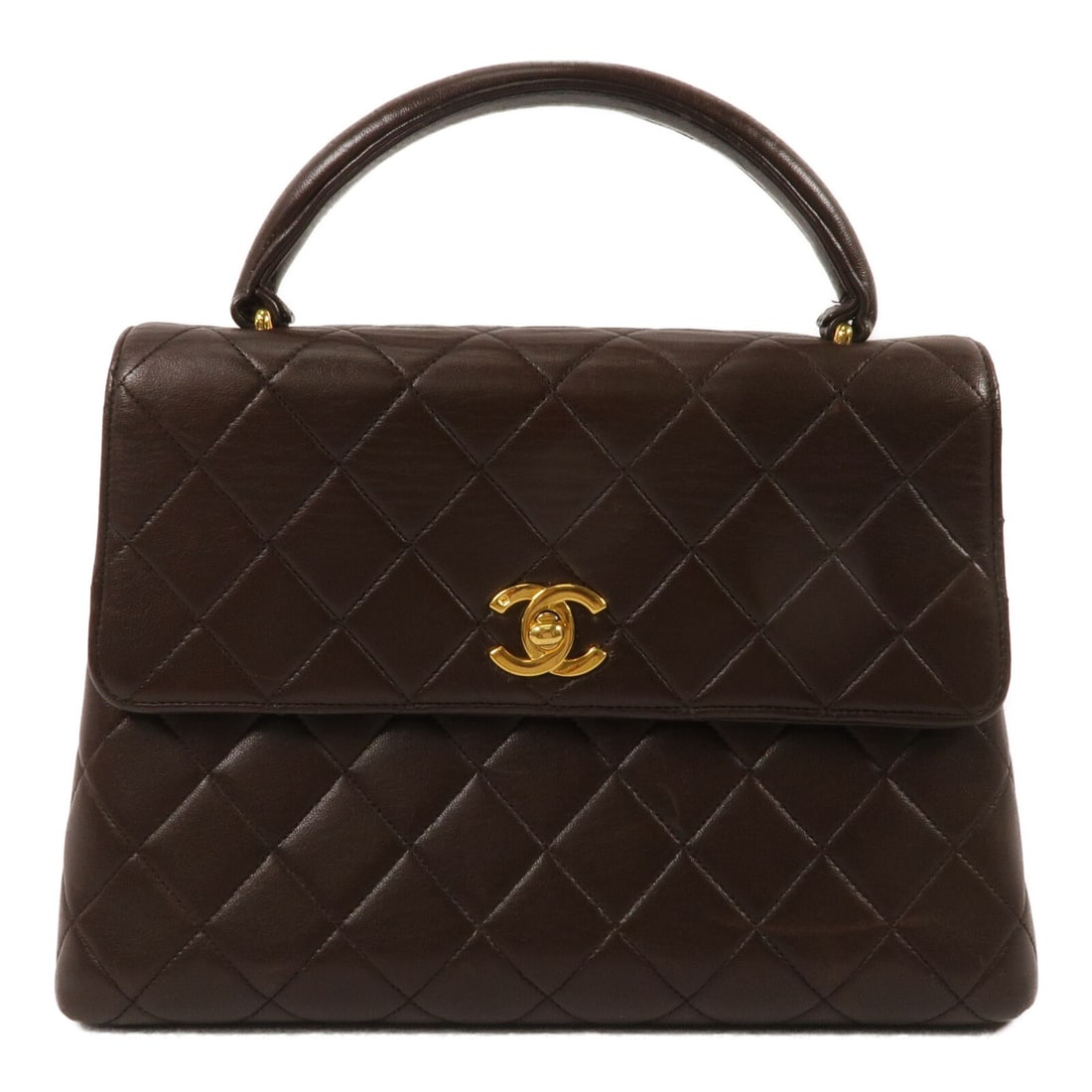 CHANEL CC Brown Lambskin Top Handle Bag with Gold Tone Hardware: CHANEL CC Brown Lambskin Top Handle Bag with Gold Tone Hardware Vintage top handle handbag in brown lambskin leather with gold-tone hardware and a turn-lock closure. It features one outside open pocke