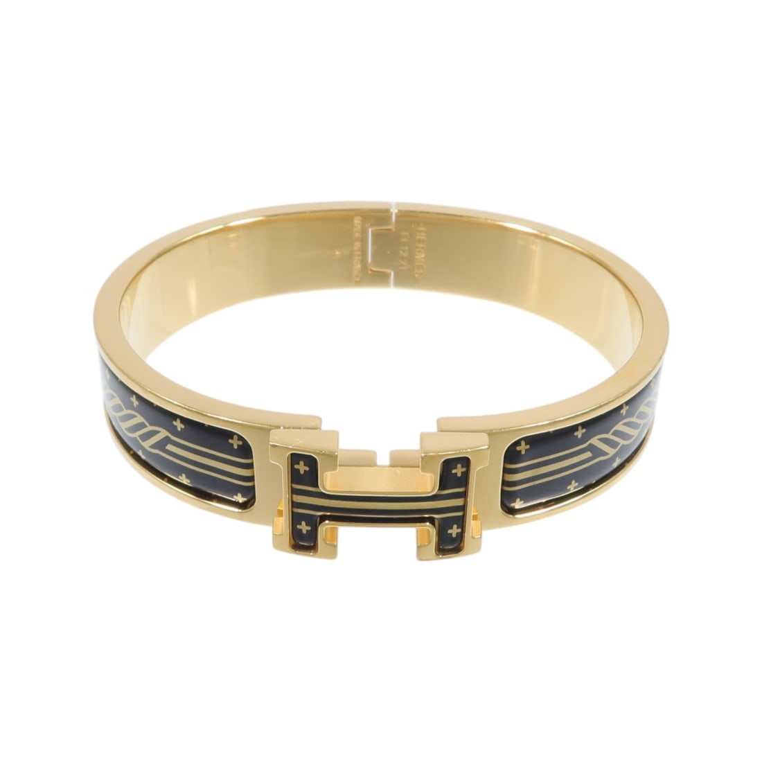 Hermes Clic H enamel metal bangle in black and gold: Hermes Clic H enamel metal bangle in black and gold Hermes Clic H bangle in metal and enamel with a black and gold color combination. It comes with a storage box and storage bags. Condition is AB: Ver