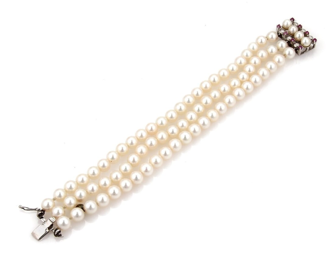 18k White Gold Triple Strand Pearl Bracelet with Pink Sapphires: 18k White Gold Triple Strand Pearl Bracelet with Pink Sapphires This vintage/estate triple strand bracelet features cultured pearls with pink sapphire accents in 18k white gold. The bracelet measures 