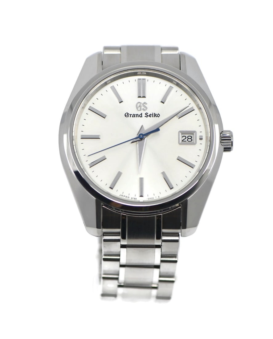 Grand Seiko SBGP001G Heritage quartz stainless steel wristwatch: Grand Seiko SBGP001G Heritage quartz stainless steel wristwatch Grand Seiko Heritage stainless steel wristwatch with a silver sunburst dial, baton indexes, and a date indicator. It features a round si