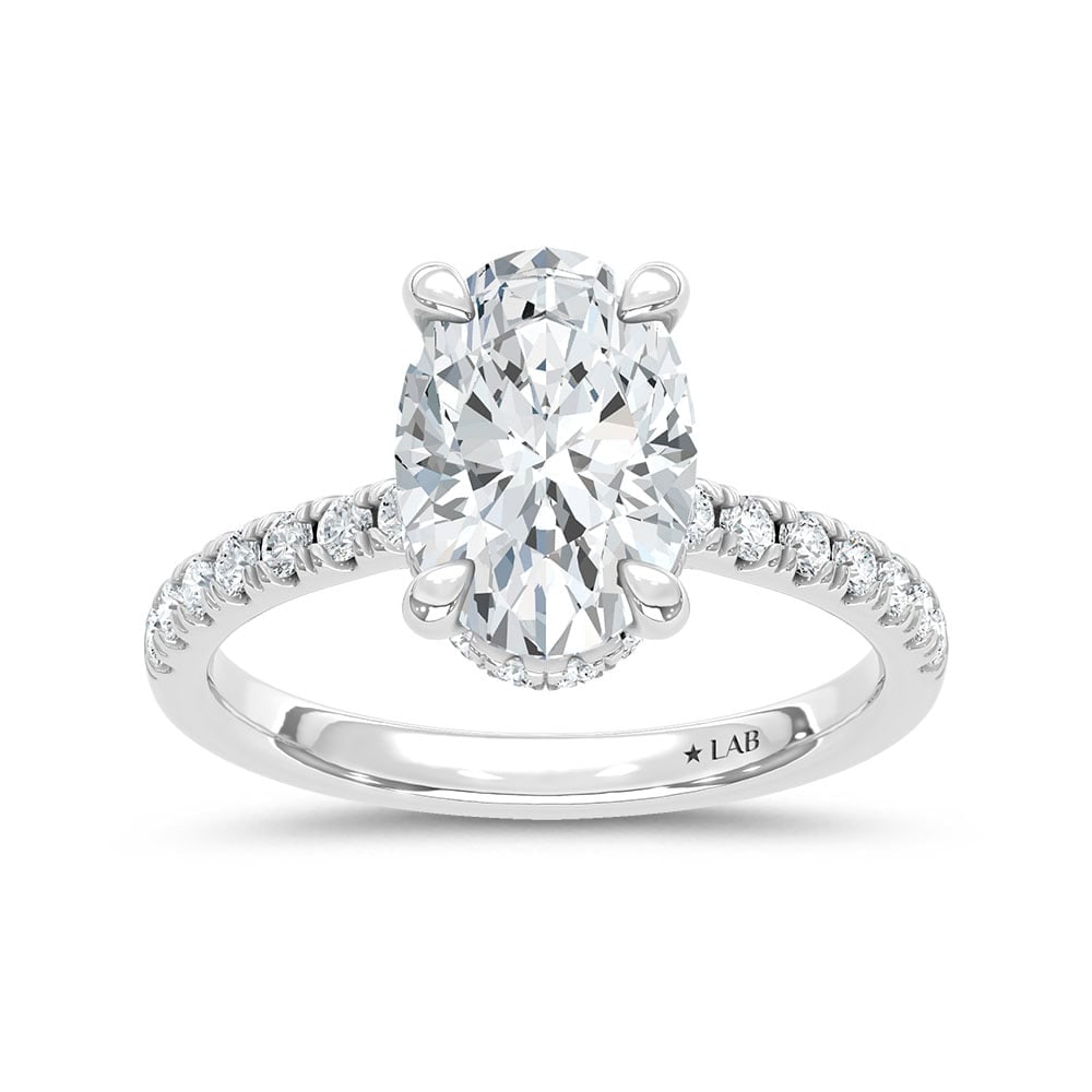 14K White Gold Lab Grown Diamond 4 1/2 Ct.Tw. Oval Hidden Halo Engagement Ring (IGI Certified: 14K White Gold Lab Grown Diamond 4 1/2 Ct.Tw. Oval Hidden Halo Engagement Ring (IGI Certified Center 4ct) Discover subtle brilliance and modern elegance with our Hidden Halo Diamond Engagement Ring. T