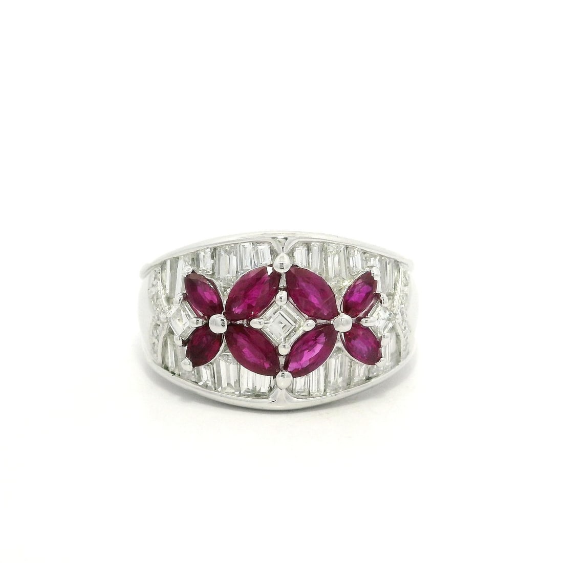 Platinum 2.23ctw Ruby Diamond Floral Band Ring: Platinum 2.23ctw Ruby Diamond Floral Band Ring This stunning platinum cocktail ring features a wide butterfly floral design adorned with an exquisite array of gemstones. At its center, the ring showca