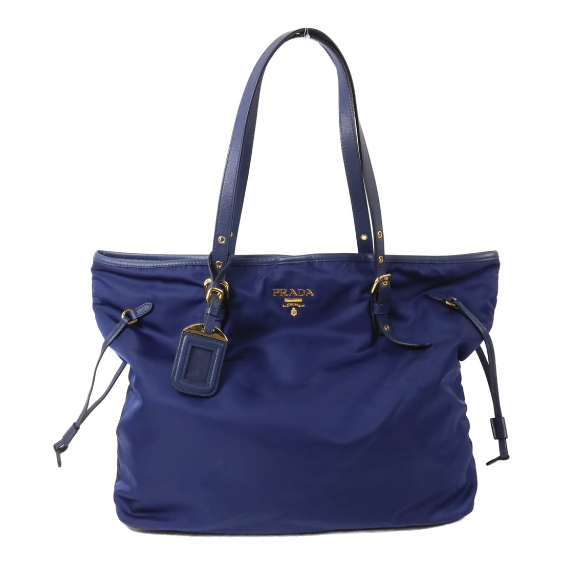 PRADA BG292 Blue Nylon Tote Bag with Name Tag: PRADA BG292 Blue Nylon Tote Bag with Name Tag Blue PRADA tote bag in nylon, model BG292, presented in very good AB condition. It features a hook button closure, an inside open pocket, an inside zip po