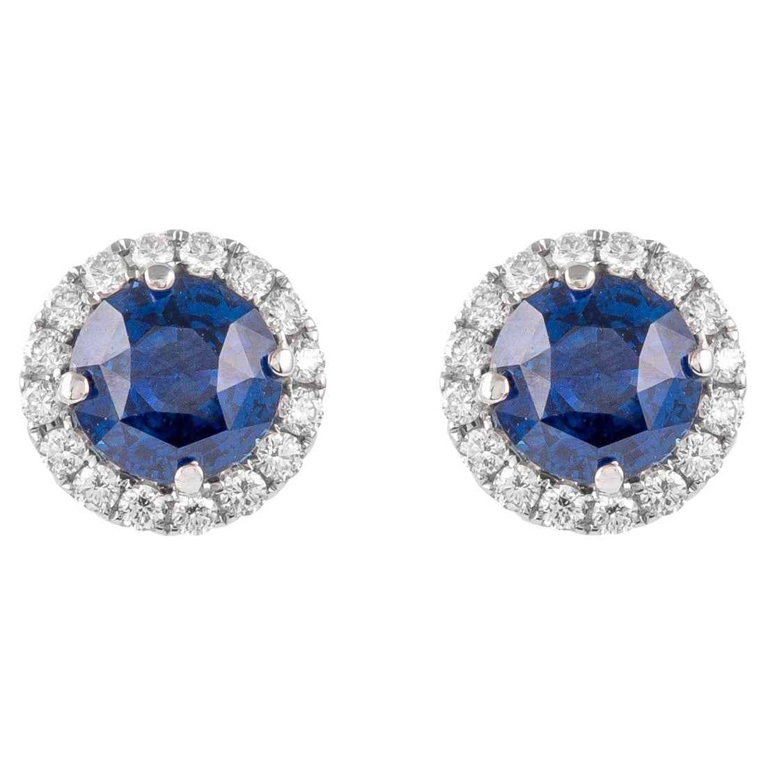 4.46ct Sapphire Diamond Halo Earrings 18k White Gold: 4.46ct Sapphire Diamond Halo Earrings 18k White Gold Discover the elegance of these contemporary stud earrings featuring 4.46 carats of stunning round sapphires elegantly framed by a halo of 32 round 