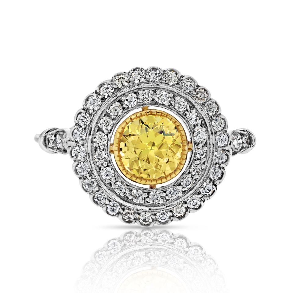 Platinum Double Halo Fancy Yellow Diamond Ring 1.05 Carat: Platinum Double Halo Fancy Yellow Diamond Ring 1.05 Carat This exquisite Platinum Fancy Yellow Ring features a stunning double halo design, showcasing a total diamond weight of 1.05 carats. Crafted fr