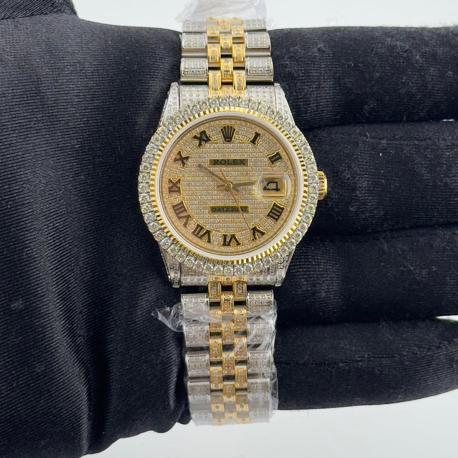 Rolex 1600 Datejust Mens Watch Aftermarket Iced Out Roman Dial Jubilee Bracelet: Rolex 1600 Datejust Mens Watch Aftermarket Iced Out Roman Dial Jubilee Bracelet This Rolex Datejust watch features an iced out Roman numeral dial and a prong plated diamond bezel. The watch is complet