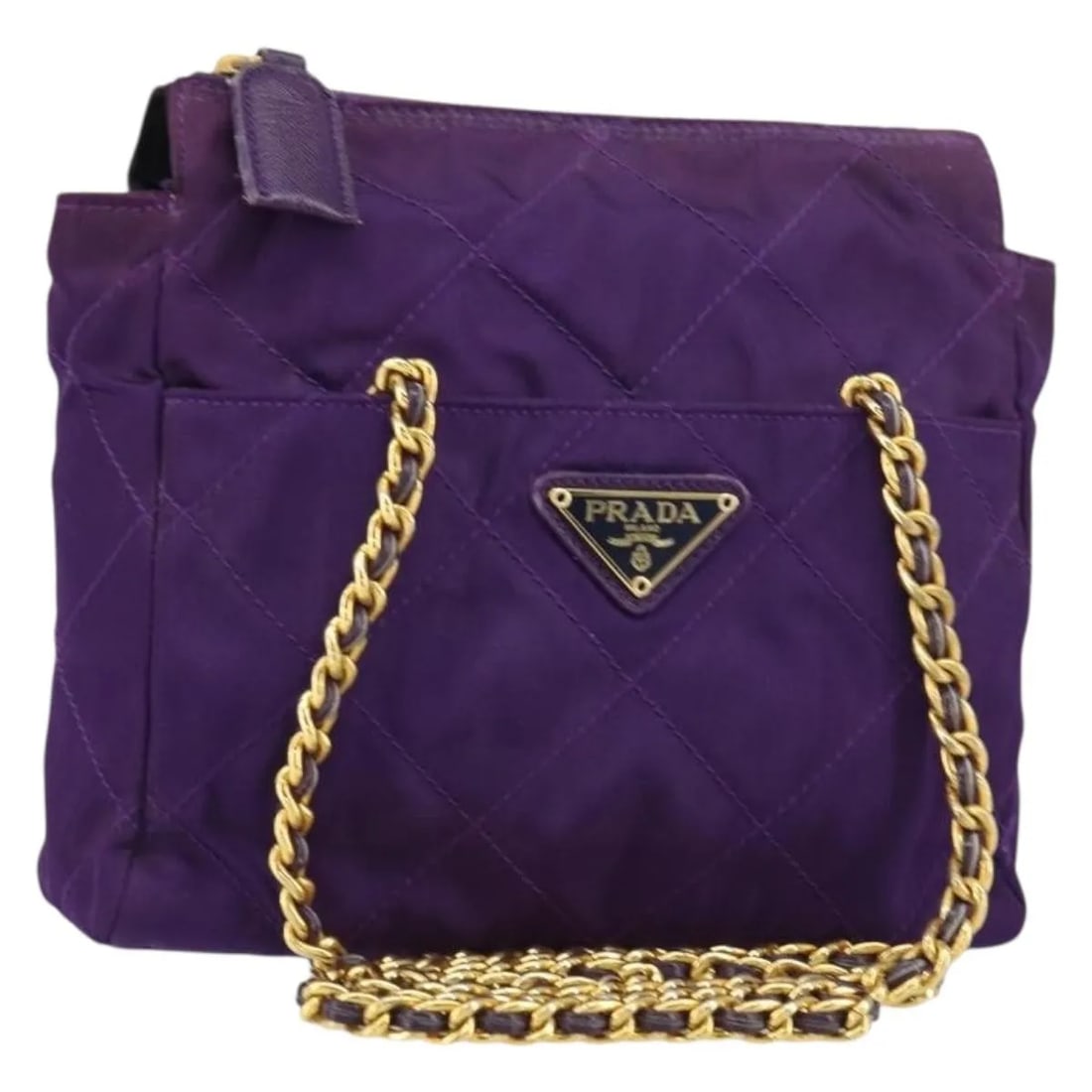 Prada 1995 Re-Edition Quilted Purple Re-Nylon Chain Tote Bag: Prada 1995 Re-Edition Quilted Purple Re-Nylon Chain Tote Bag This Prada Re-Edition 1995 Chain Tote is crafted from quilted Re-Nylon in a vibrant purple color. Designed for women, it features a compact
