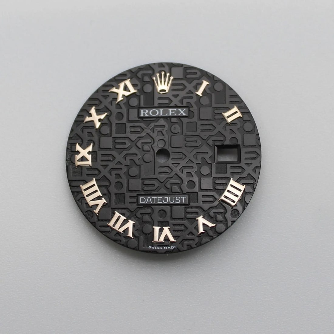Black Roman Numeral Dial for Rolex Datejust Jubilee 116234: Black Roman Numeral Dial for Rolex Datejust Jubilee 116234 This is a pre-owned Rolex black dial designed for the Jubilee Datejust model. It features a 12-hour display with Roman numerals, combining cl