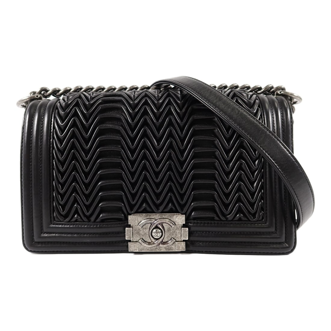 Chanel Boy 25 Lambskin Chain Shoulder Bag Black SHW: Chanel Boy 25 Lambskin Chain Shoulder Bag Black SHW A CHANEL Boy 25 chain shoulder bag in black lambskin leather with CC SHW hardware. It features a flap closure, one open interior pocket, and comes w
