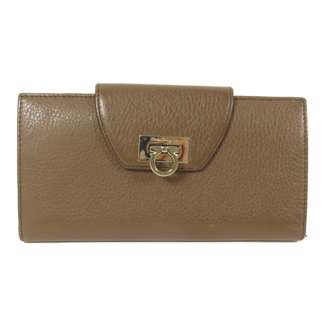 Brown Calfskin Long Bifold Wallet Salvatore Ferragamo SHW: Brown Calfskin Long Bifold Wallet Salvatore Ferragamo SHW A long bifold wallet in brown calfskin leather with a flap closure. It features 5 open pockets, 1 wallet compartment, 1 coin case, 13 card slo