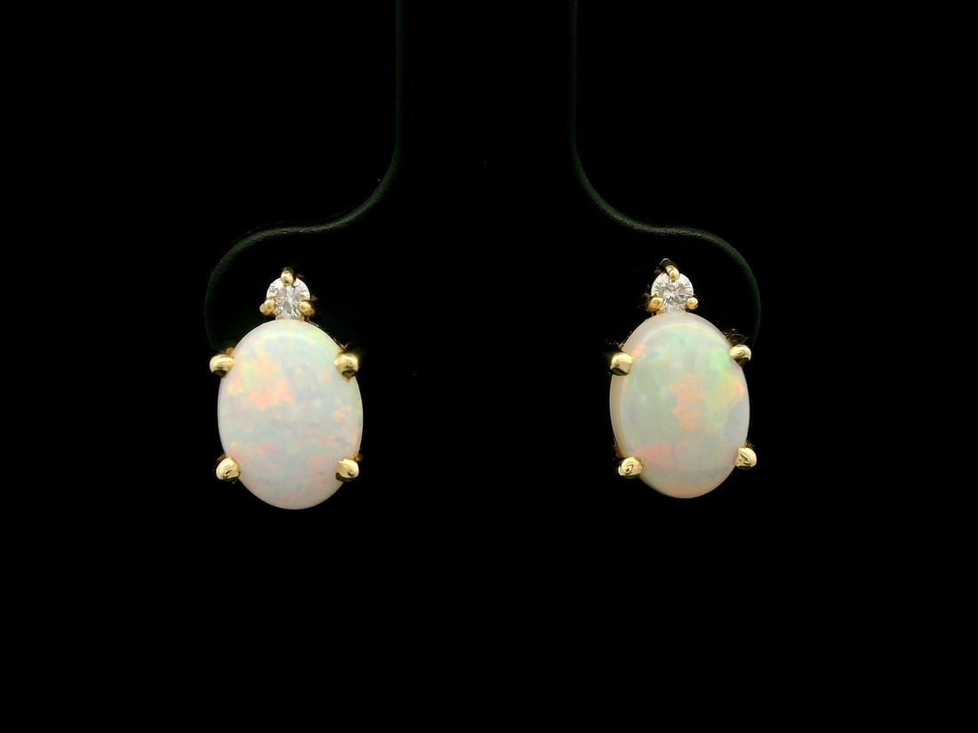 Elegant 14k Yellow Gold Opal Diamond Stud Earrings: Elegant 14k Yellow Gold Opal Diamond Stud Earrings Elevate your elegance with these classic petite stud earrings, featuring stunning natural opals and diamonds. Crafted in solid 14k yellow gold, each 