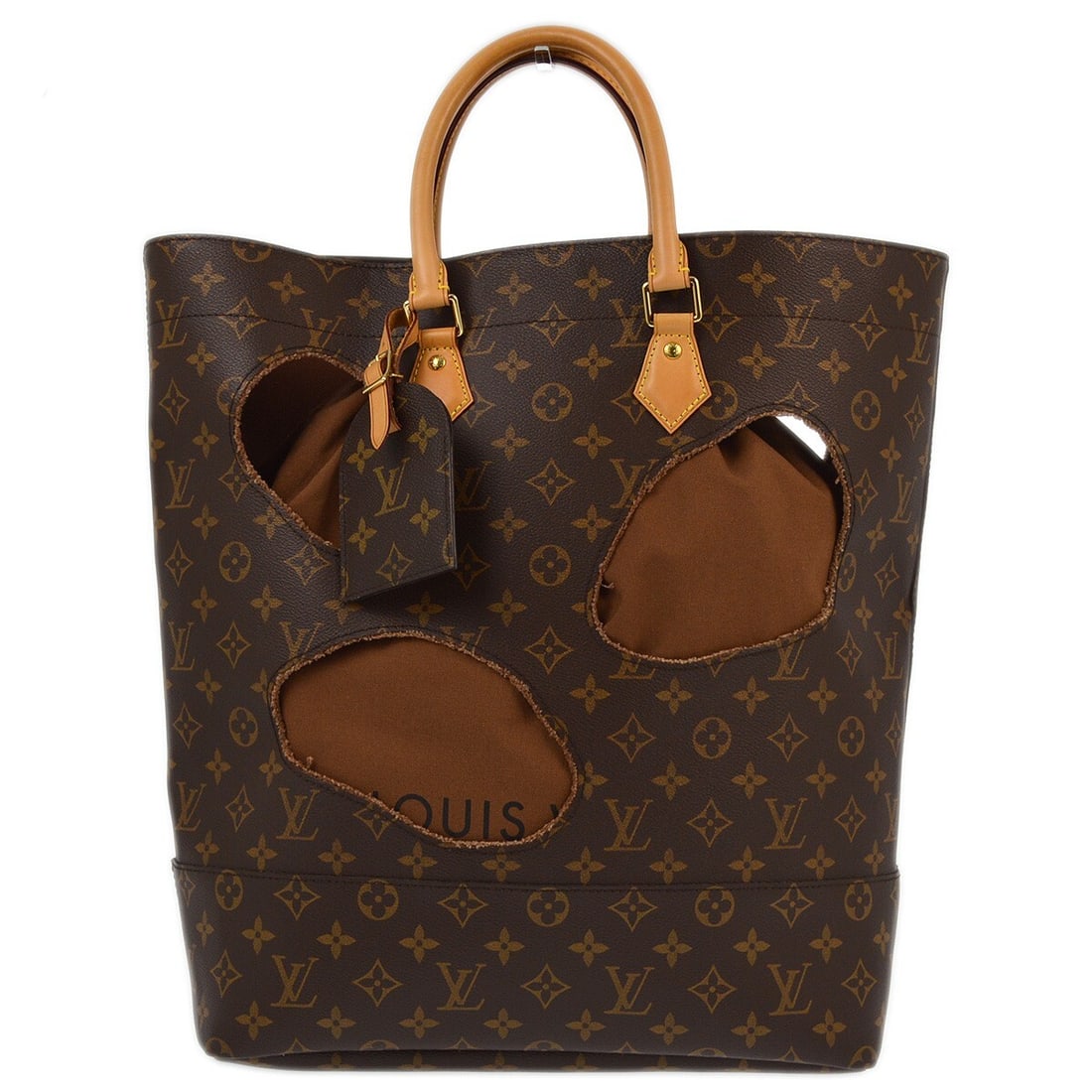 Louis Vuitton Comme des Garcons Bag With Holes Monogram Tote M40279: Louis Vuitton Comme des Garcons Bag With Holes Monogram Tote M40279 Louis Vuitton Bag With Holes tote bag from the Comme des Garcons collaboration in brown Monogram canvas and leather. This limited ed