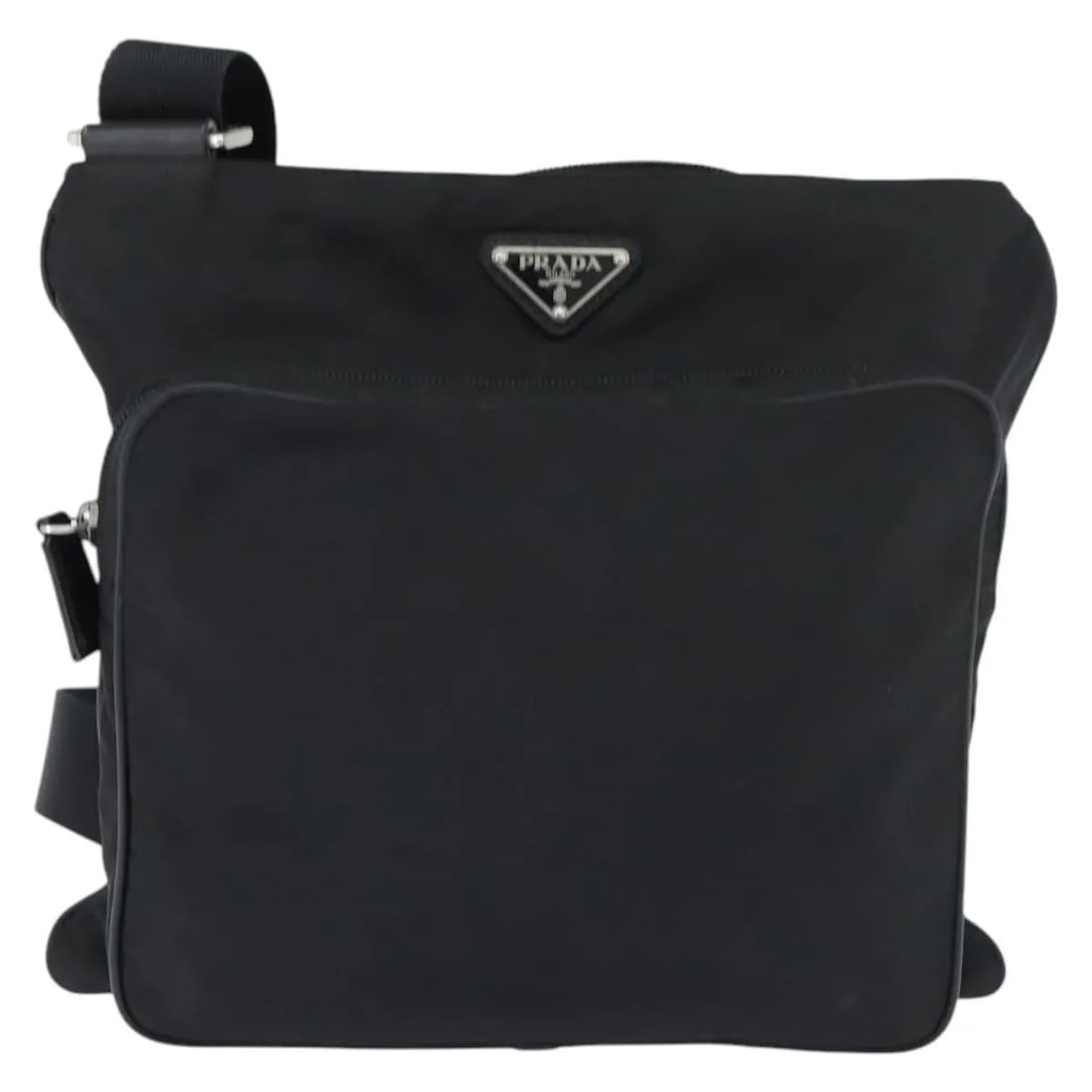 Prada Black Nylon Messenger Bag with Front Pocket: Prada Black Nylon Messenger Bag with Front Pocket This Prada Front Pocket Messenger Bag is crafted from black nylon and designed for women. It features a spacious interior with a front pocket and a sh