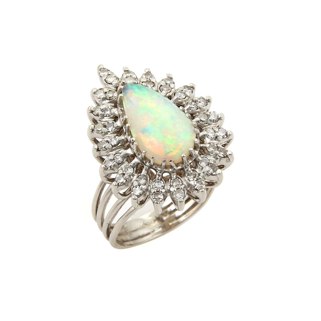14k White Gold Pear Shape Cocktail Ring with Fire Opal and Diamonds Size 7: 14k White Gold Pear Shape Cocktail Ring with Fire Opal and Diamonds Size 7 This vintage/estate cocktail ring is crafted in 14k white gold and features a pear-shaped Australian fire opal accented with 