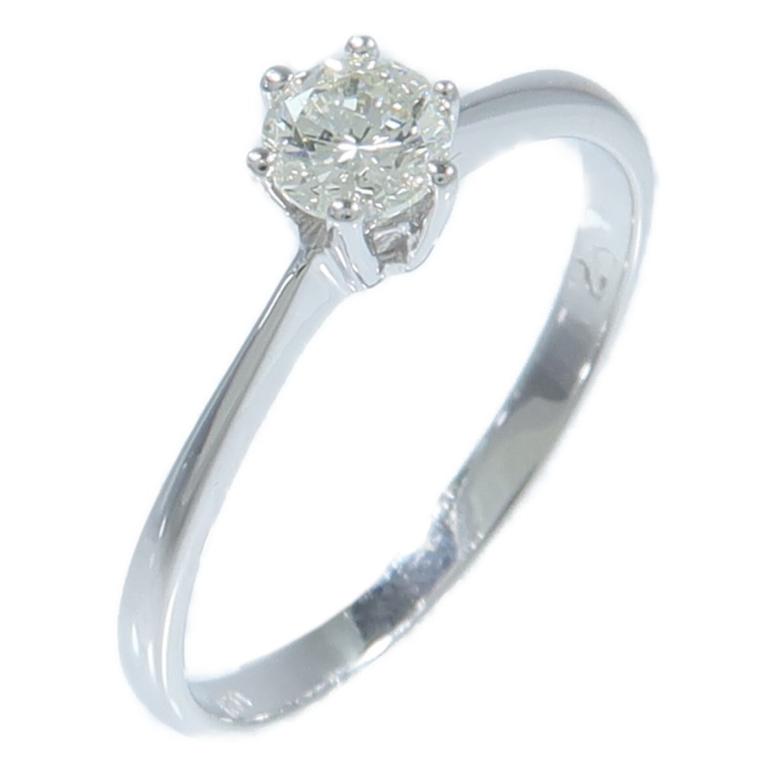 18K White Gold Diamond Ring Size 5.75 0.20ct: 18K White Gold Diamond Ring Size 5.75 0.20ct Diamond ring in 18K white gold with diamond accents. The ring is size 5.75 and features a clear diamond with a total diamond weight of 0.20 ct. It has a ri