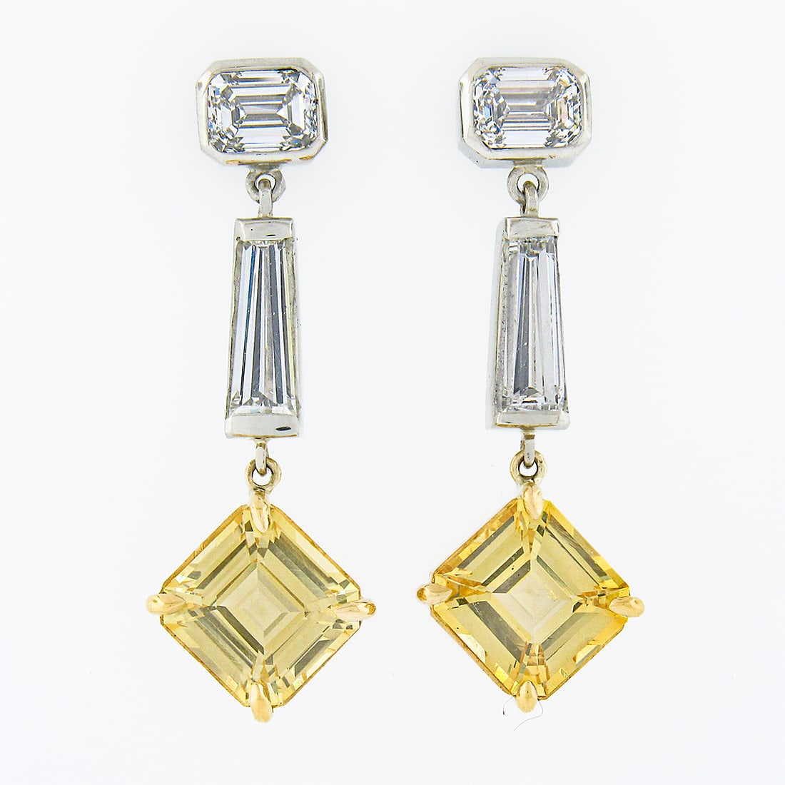 18k Gold & Platinum GIA Ceylon Yellow Sapphire Diamond Dangle Earrings: 18k Gold & Platinum GIA Ceylon Yellow Sapphire Diamond Dangle Earrings Introducing a stunning pair of custom-made drop dangle earrings, crafted from solid 18k yellow gold and 950 platinum. These earri