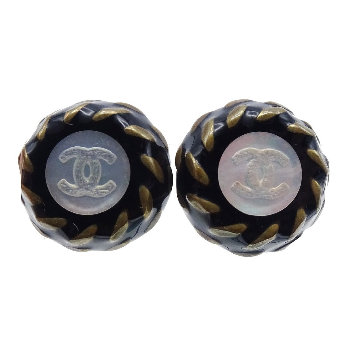 Chanel 97A Clip-On Button Earrings in Black and Gold: Chanel 97A Clip-On Button Earrings in Black and Gold Clip-on Chanel button earrings in black and gold, made in France. The design features a classic button style with reasonable wear and tear consiste