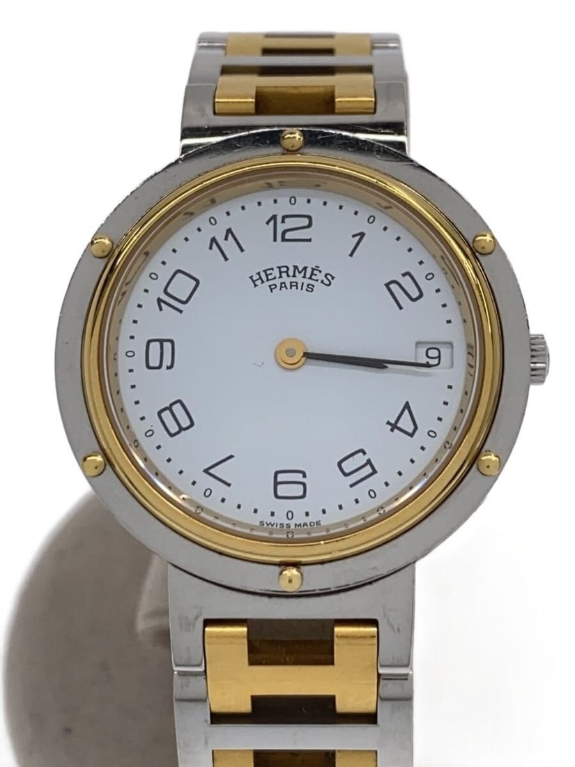 Hermes Clipper Two Tone Quartz Ladies Wristwatch: Hermes Clipper Two Tone Quartz Ladies Wristwatch This HERMES Clipper women's wristwatch features a quartz movement and a stainless steel and gold combination design. Made in Switzerland, it has a clas