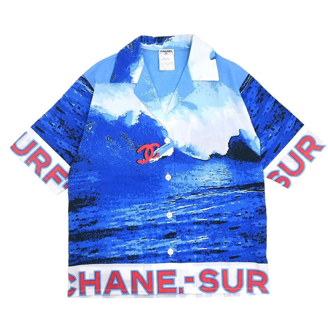 CHANEL Surf Line Womens Blue Cotton Collared Top FR 36: CHANEL Surf Line Womens Blue Cotton Collared Top FR 36 Chanel Surf Line short sleeve top in blue cotton with a collared neckline, regular fit, and logo accent. Made in France, this women's casual shir