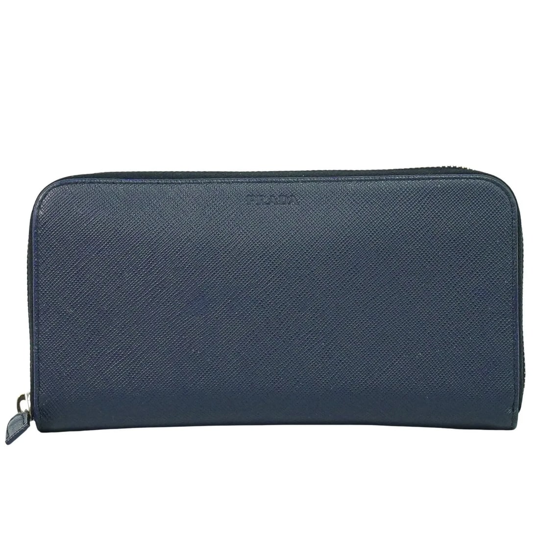 Prada Saffiano Navy Leather Wallet: Prada Saffiano Navy Leather Wallet This Prada Saffiano wallet is crafted from navy leather and designed for women. It features a spacious interior and exhibits signs of use, including slight scuffing 