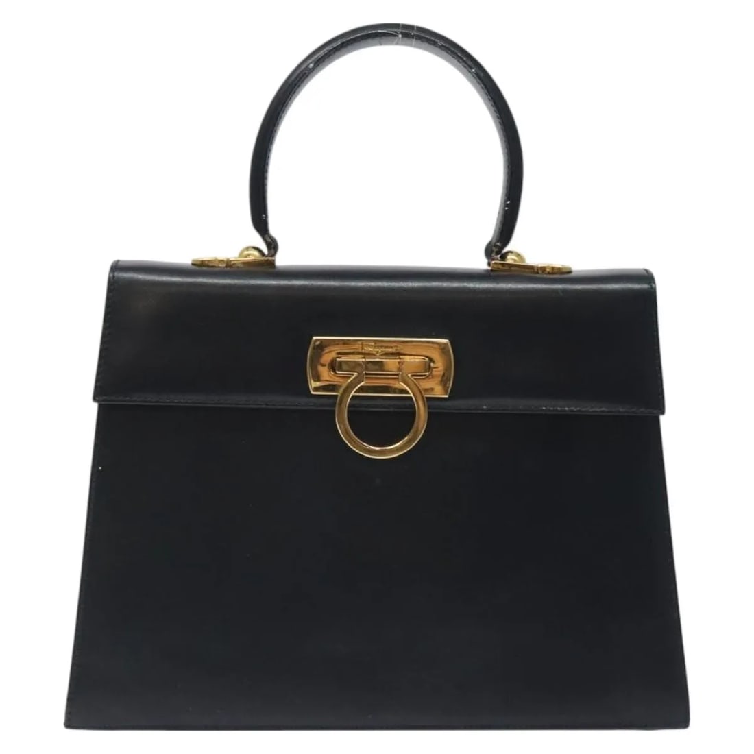 Black Leather Convertible Bag by Salvatore Ferragamo with Top Handle: Black Leather Convertible Bag by Salvatore Ferragamo with Top Handle This Salvatore Ferragamo convertible top handle bag is crafted from black leather and designed for women. The bag features a top ha