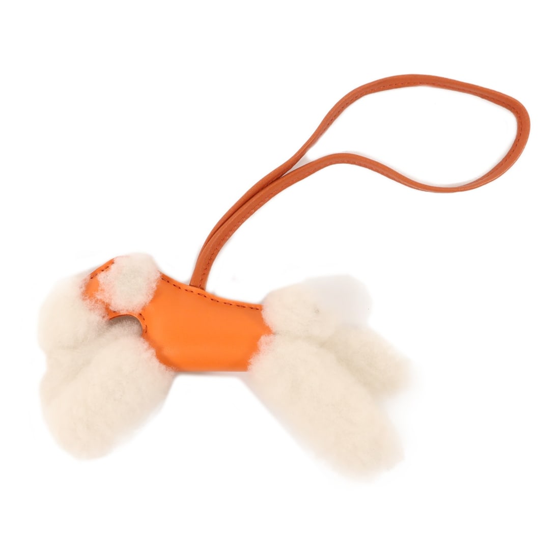 Hermes Budy Bag Charm Milo Lambskin Wool Capucine Sienne: Hermes Budy Bag Charm Milo Lambskin Wool Capucine Sienne Hermes Budy Charm Milo Leather Wool Capucine Sienne. It is described as a charm in Capucine, White, Orange, Capucine, and Sienne colors, with m
