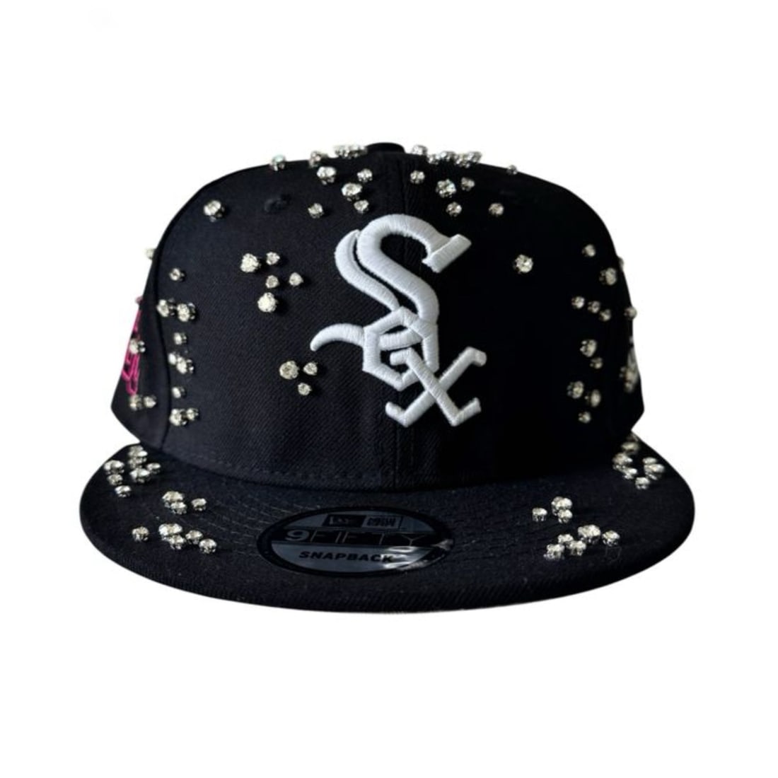 Studded Black Snapback Cap with Sox Logo by Retrovert: Studded Black Snapback Cap with Sox Logo by Retrovert The Retrovert Kitted Sox Studded Black Snapback Hat features a structured six-panel design with a classic snapback closure for adjustable comfort.