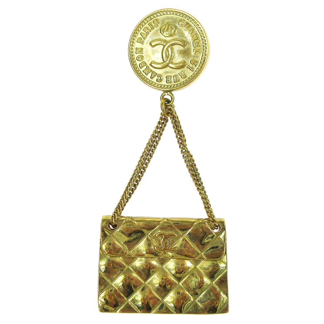 Chanel Gold Tone Handbag Motif Brooch Pin 94P: Chanel Gold Tone Handbag Motif Brooch Pin 94P Gold-tone Chanel brooch in a bag motif, made in France. This piece features a miniature handbag design and shows reasonable wear and tear consistent with 