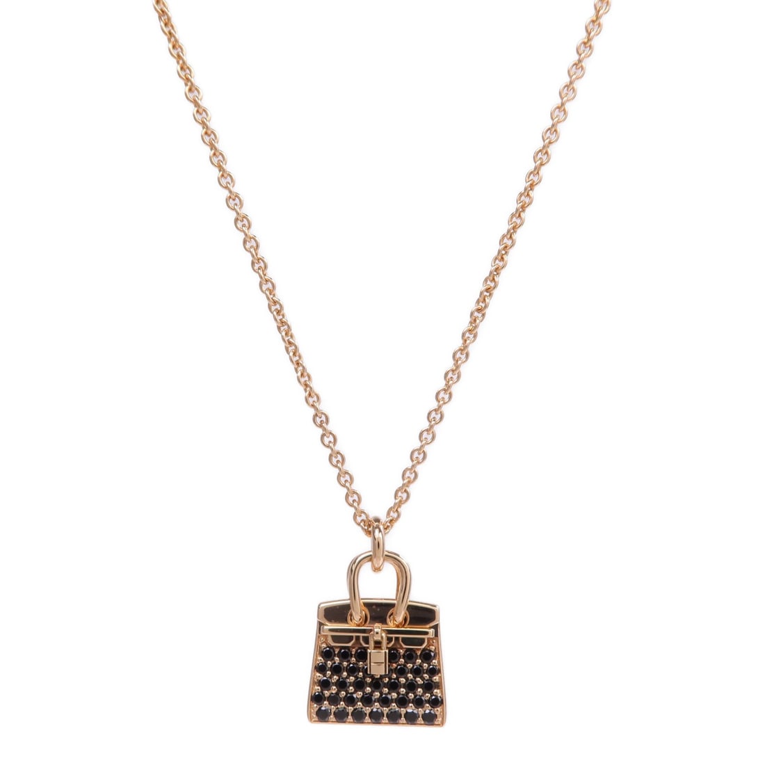 Hermes Amulettes Kelly Spinel Necklace 18K Rose Gold: Hermes Amulettes Kelly Spinel Necklace 18K Rose Gold Hermes Amulettes Kelly Pendant Necklace in K18 pink gold with spinel and black accents. This women's necklace is made in France and comes with a st