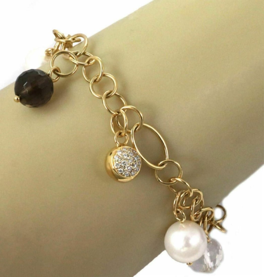 K Di Kuore 18k Gold Charm Bracelet with Diamonds Pearls Quartz: K Di Kuore 18k Gold Charm Bracelet with Diamonds Pearls Quartz A charm-style link bracelet crafted in 18k yellow gold and accented with natural diamonds, pearls, clear quartz, and smoky quartz beads. 