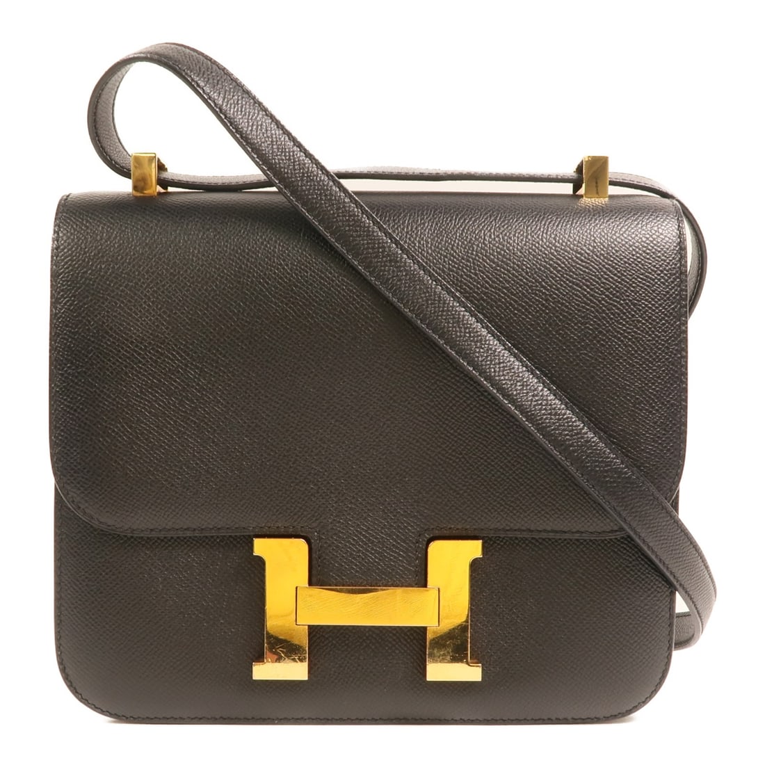 Hermes Constance 24 Shoulder Bag Noir Veau Epsom Leather: Hermes Constance 24 Shoulder Bag Noir Veau Epsom Leather A Hermes Constance 24 2 Way Shoulder Bag in Noir black, crafted from Epsom leather, calfskin, and Veau Epsom. This model features belt hardware