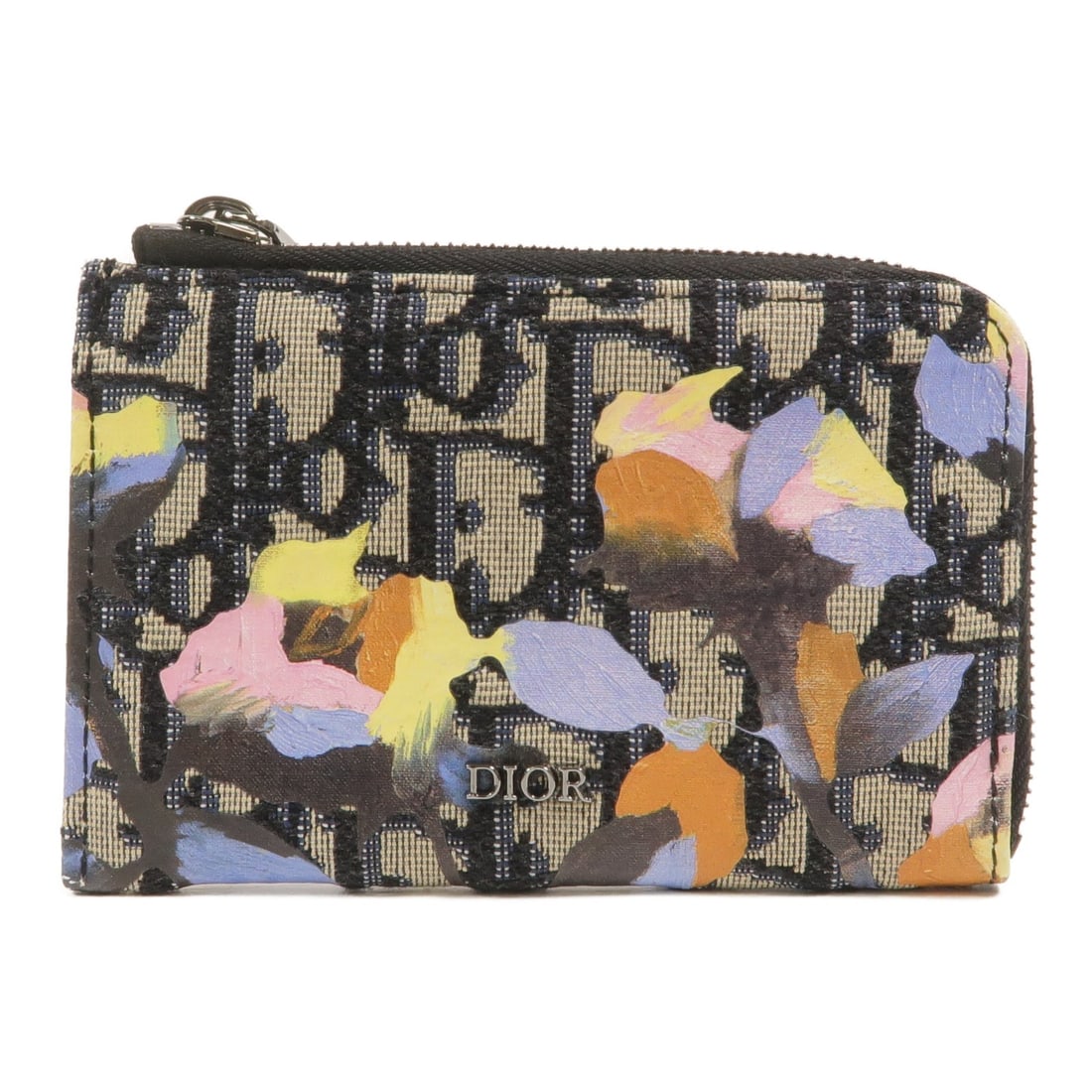 Dior CD coin case in blue beige canvas limited edition: Dior CD coin case in blue beige canvas limited edition Limited edition Christian Dior coin case in blue and beige canvas. It features a fastener opening and two card pockets. The item is in AB very go
