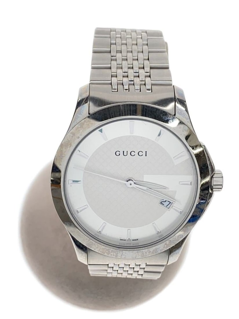 Gucci G Timeless stainless steel quartz date women's wristwatch: Gucci G Timeless stainless steel quartz date women's wristwatch This GUCCI G-TIMELESS Quartz Date Women's Watch features a stainless steel case and band in a sleek silver tone. Designed for women, thi
