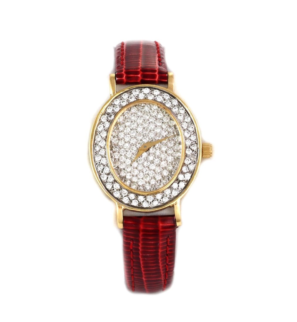 Universal Geneve 2.00ct Diamond 18k Gold Oval Watch with Leather Band: Universal Geneve 2.00ct Diamond 18k Gold Oval Watch with Leather Band This stunning Universal Geneve wristwatch features a luxurious oval case crafted from 18k yellow gold, adorned with a dazzling tot