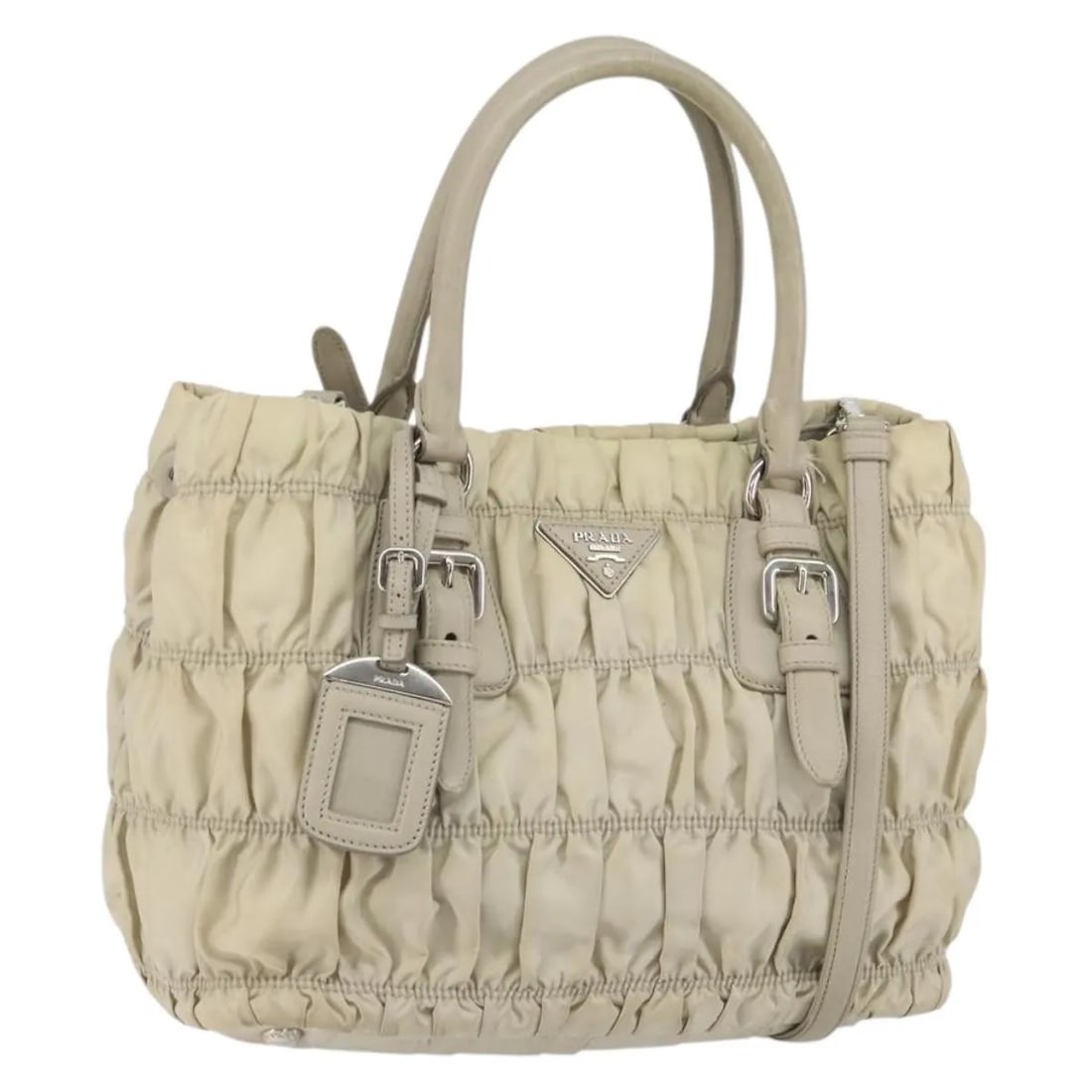 Beige Nylon Prada Gaufre Convertible Tote Bag 27cm x 23cm x 16cm: Beige Nylon Prada Gaufre Convertible Tote Bag 27cm x 23cm x 16cm This Prada Gaufre Convertible Tote for women features a beige nylon exterior with visible signs of wear including rubbing, stains, and 