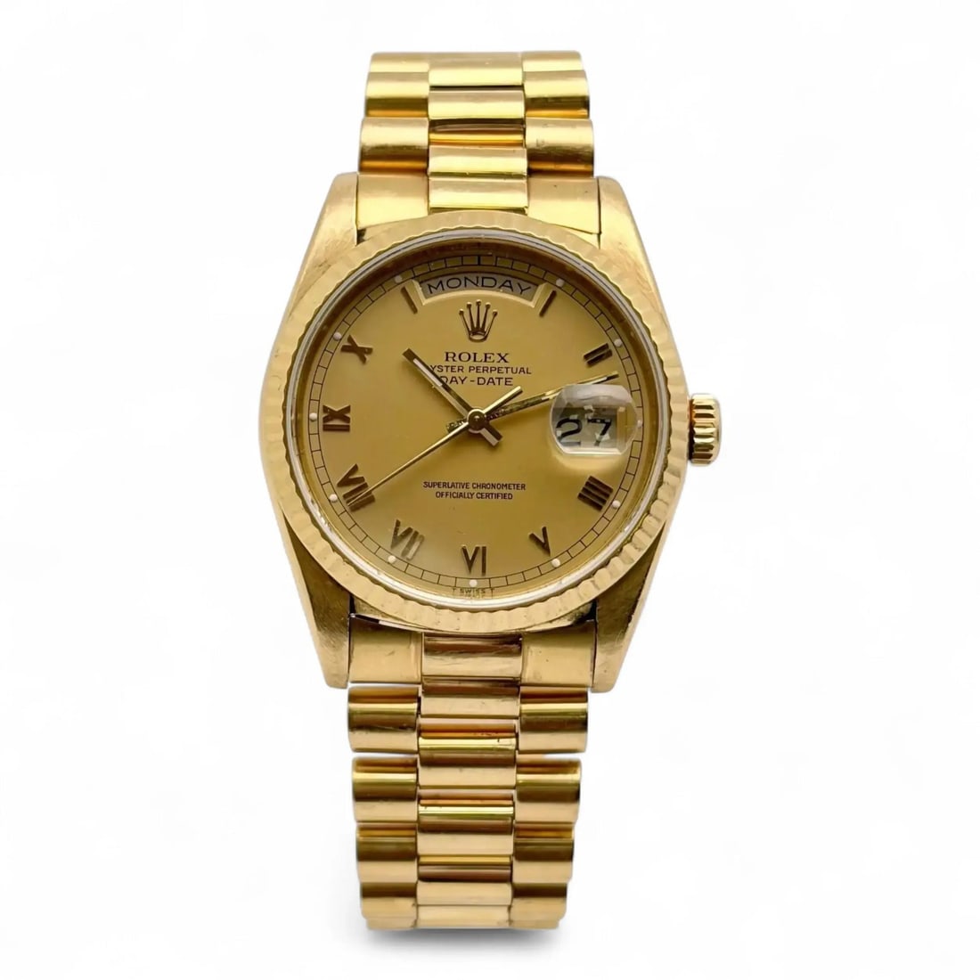 18K Yellow Gold Rolex Day-Date 36mm Champagne Roman Dial Model 18238: 18K Yellow Gold Rolex Day-Date 36mm Champagne Roman Dial Model 18238 This pre-owned Rolex President Day-Date 36mm wristwatch features an 18K yellow gold case and bracelet, a fluted fixed bezel, and a 