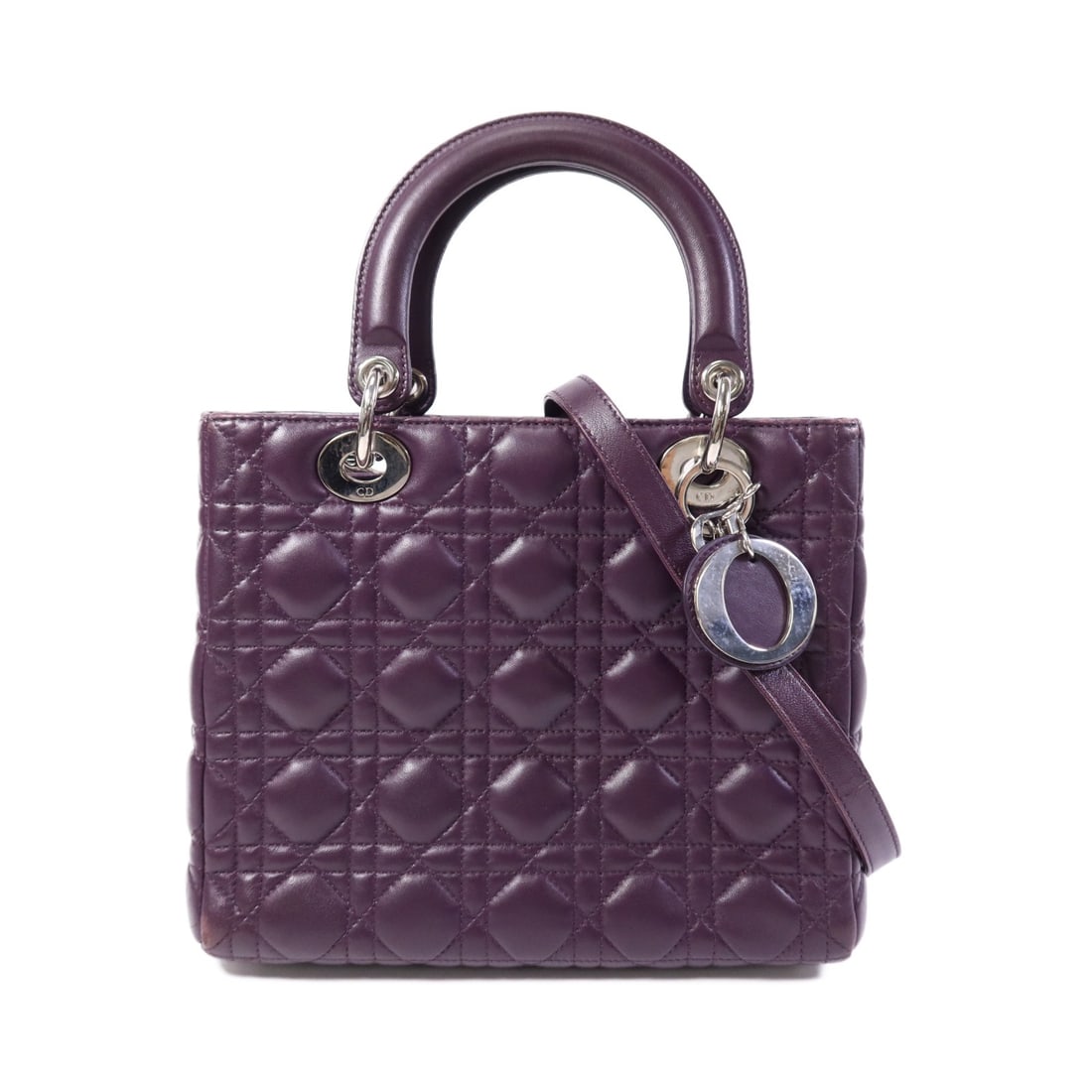 Dior Lady Dior 2 Way Shoulder Bag Purple Lambskin CD SHW: Dior Lady Dior 2 Way Shoulder Bag Purple Lambskin CD SHW This Christian Dior Lady Dior 2-way shoulder bag is crafted from lambskin (sheep leather) in purple. It features a structured design with a sho