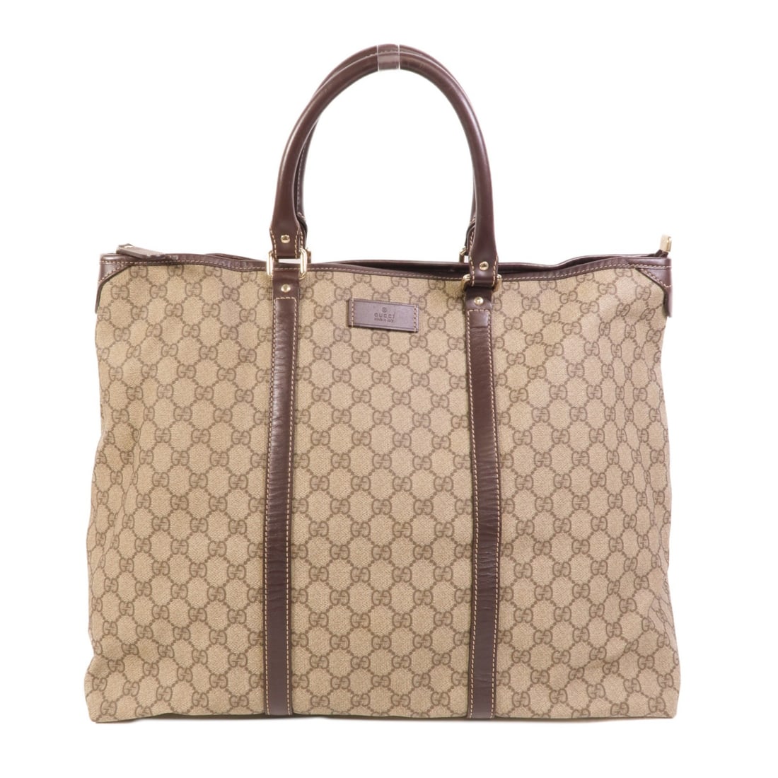 Gucci 201482 GG Tote Bag Brown PVC Coated Canvas SHW: Gucci 201482 GG Tote Bag Brown PVC Coated Canvas SHW A Gucci GG SHW tote bag in brown PVC coated canvas, model 201482. It features one open inside pocket and comes with a storage bag. The item is in B