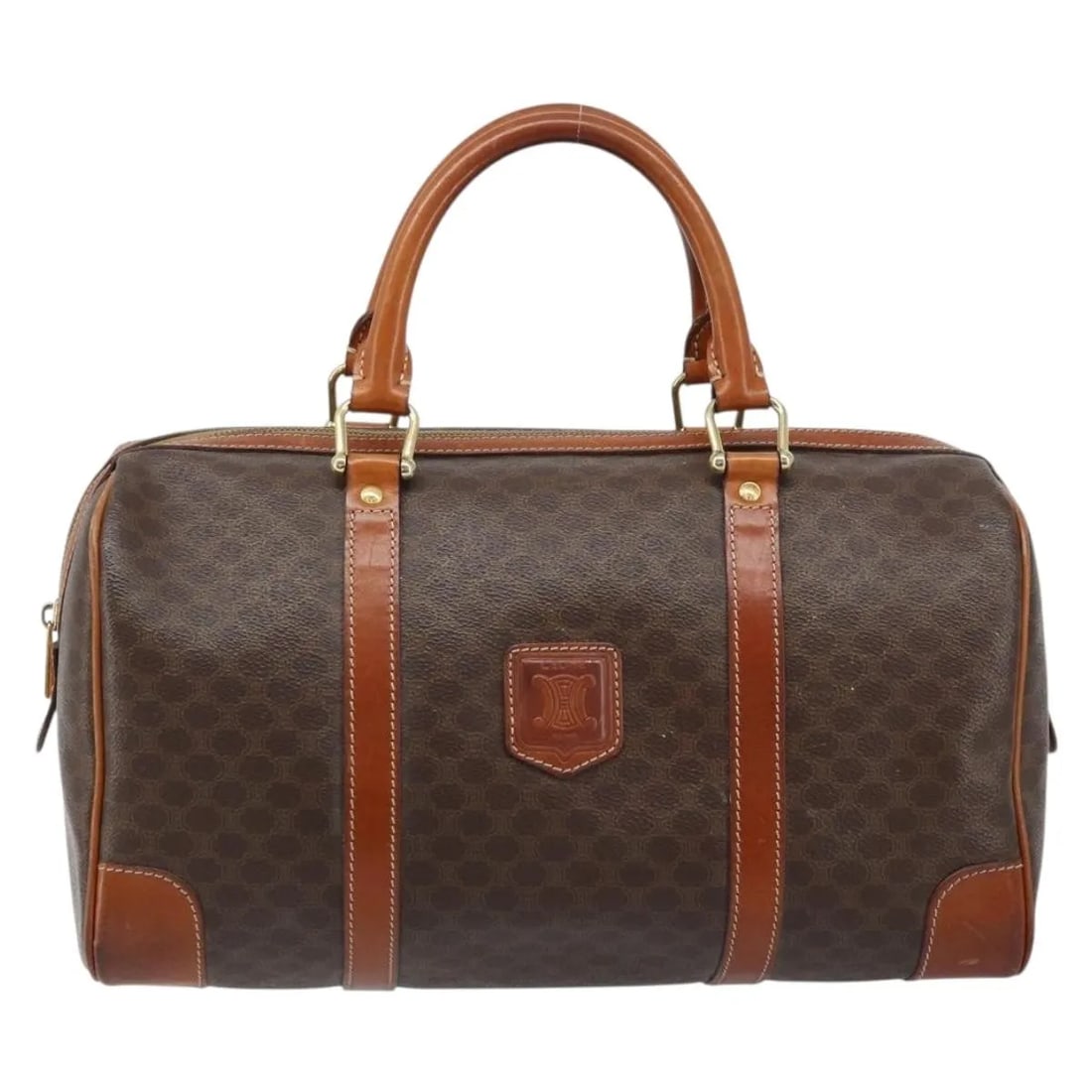 Celine Brown Canvas Vintage Duffle Bag with Leather Trim: Celine Brown Canvas Vintage Duffle Bag with Leather Trim This Celine vintage duffle bag features a classic brown canvas exterior with leather accents, designed for women. The bag shows signs of wear c