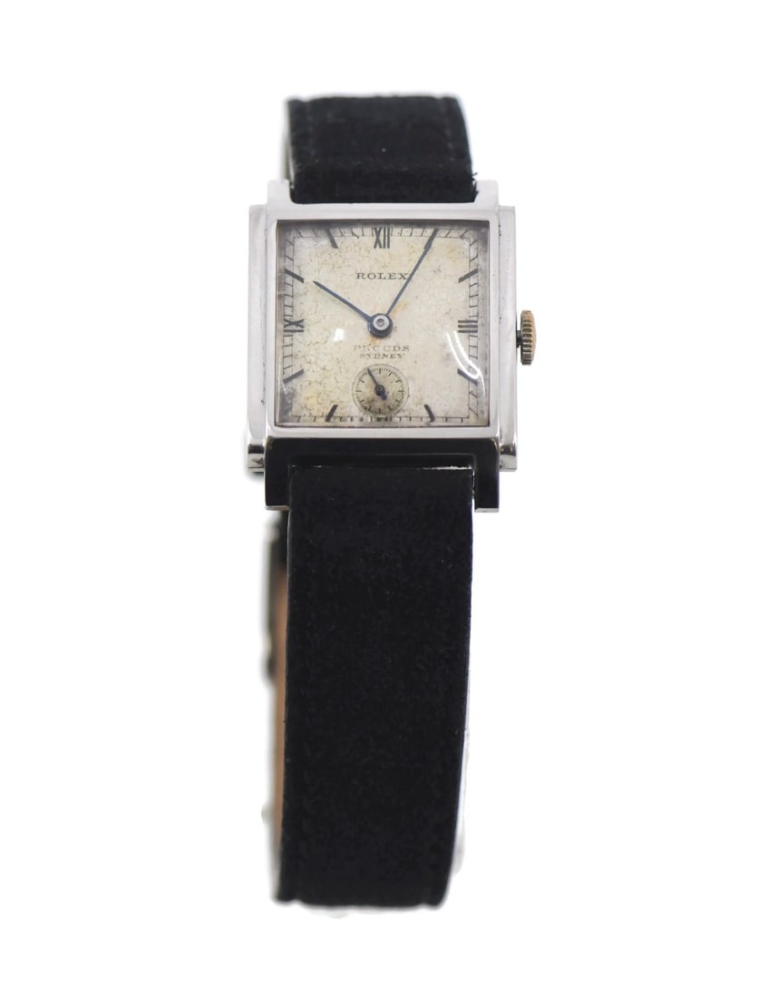 Vintage Rolex 25mm Mechanical Stainless Steel Wristwatch with Leather Band: Vintage Rolex 25mm Mechanical Stainless Steel Wristwatch with Leather Band This vintage Rolex wristwatch features a stainless steel case and a leather band, offering a timeless and classic look. Desig