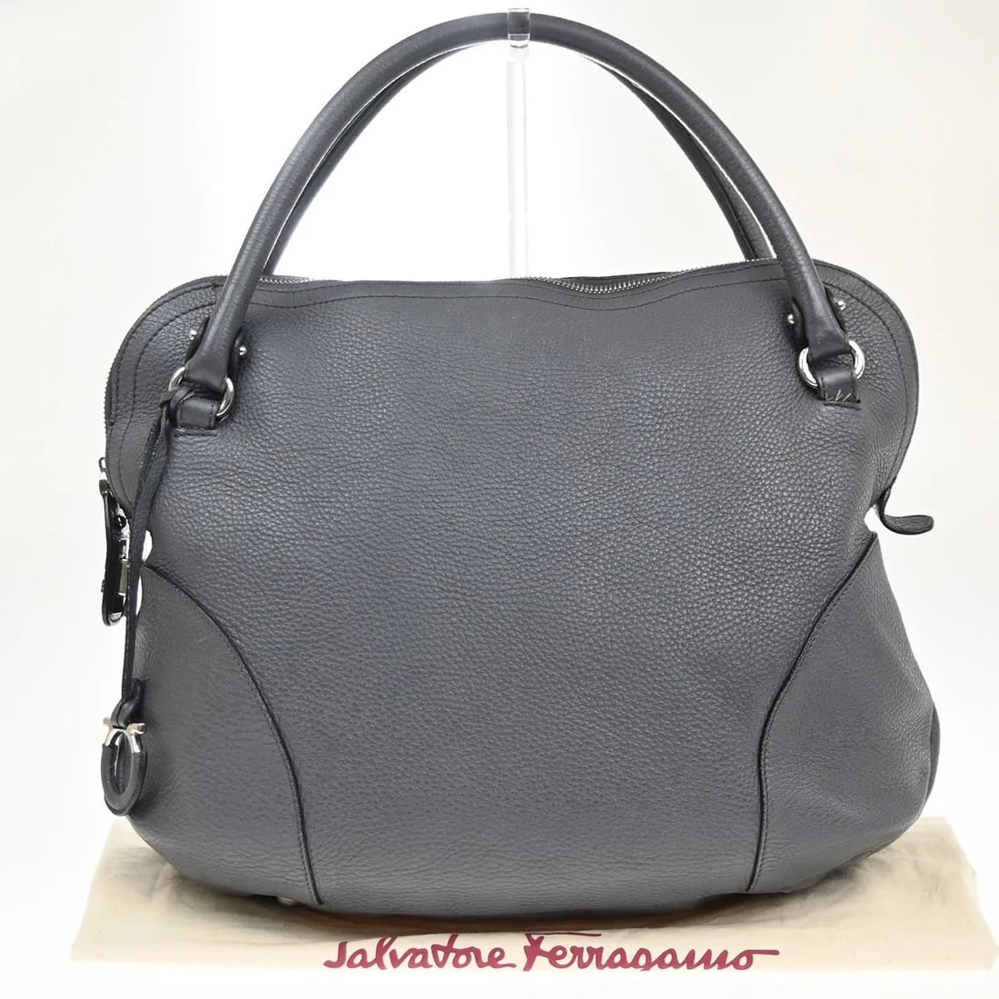 Bonaria Gray Leather Satchel by Salvatore Ferragamo Italy: Bonaria Gray Leather Satchel by Salvatore Ferragamo Italy This Salvatore Ferragamo Bonaria Satchel is crafted from gray leather and designed for women. The bag shows cracks on the handle edge leather 