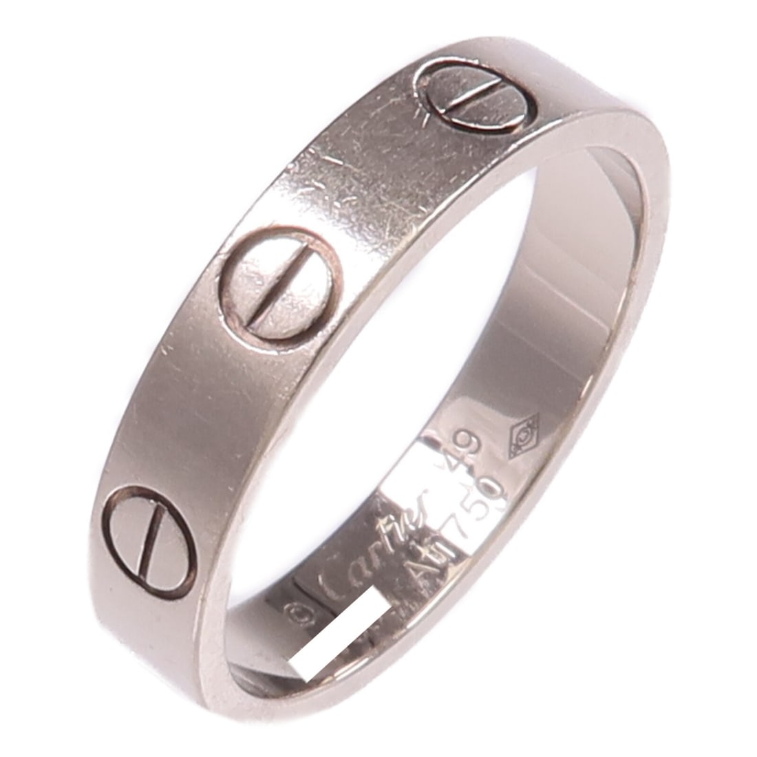 Cartier Mini Love Ring 18K White Gold Size 49 US 4.75: Cartier Mini Love Ring 18K White Gold Size 49 US 4.75 Cartier Mini Love Ring in 18K white gold, presented in size US 4.75 / Cartier #49. The ring is described as silver in color and comes with a stora