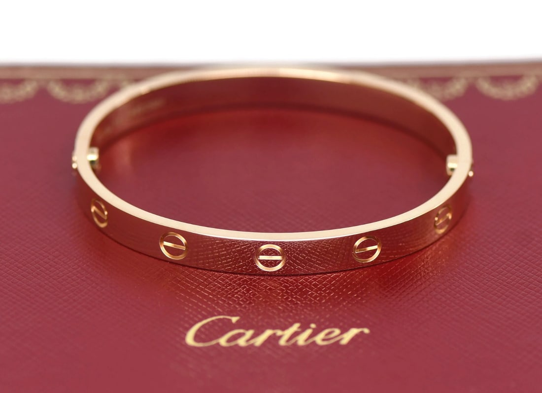 Cartier Love 18K Rose Gold Bangle Bracelet Size 16: Cartier Love 18K Rose Gold Bangle Bracelet Size 16 This Cartier Love Bracelet is crafted from 18K rose gold and features a classic bangle design in size 16. The bracelet showcases the iconic Love them